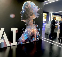 Artificial intelligence sign in the United Imaging booth. The Chinese company wants to break into the U.S. market and has a massive booth footprint at RSNA 2023. This included a section for its own AI development division. Photo by Dave Fornell #RSNA