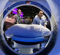RSNA attendees through bore of the new release Philips CT 5300 scanner at RSNA 2024. Three new CT systems were released at RSNA that included numerous AI enhancements. Photo by Dave Fornell. #RSNA #RSNA24 #RSNA2024 